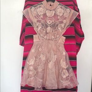 ASOS pink high neck mini with flower detail